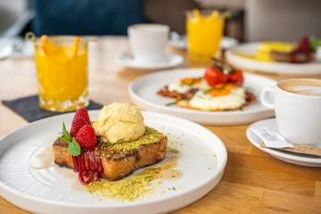 French toast with ice cream and raspberries for breakfast.