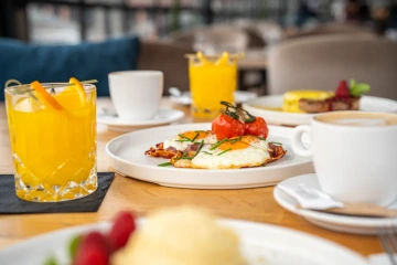 Sweet breakfast, French toast with ice cream, coffee and fresh juice.